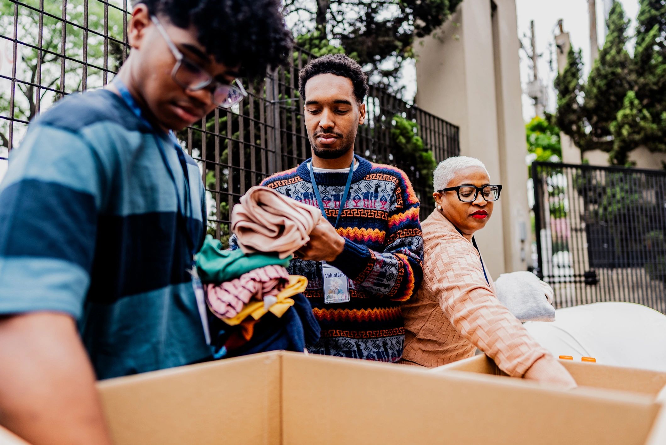 Volunteers sorting donations, representing community giveback